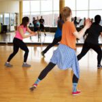 Compound Exercises - women dancing near mirror