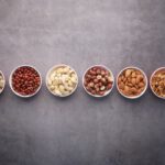 Vegan Protein - brown nuts on white ceramic bowls