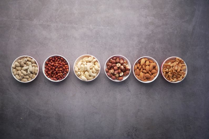 Vegan Protein - brown nuts on white ceramic bowls