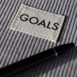 Goal Setting - black and silver pen on gray textile