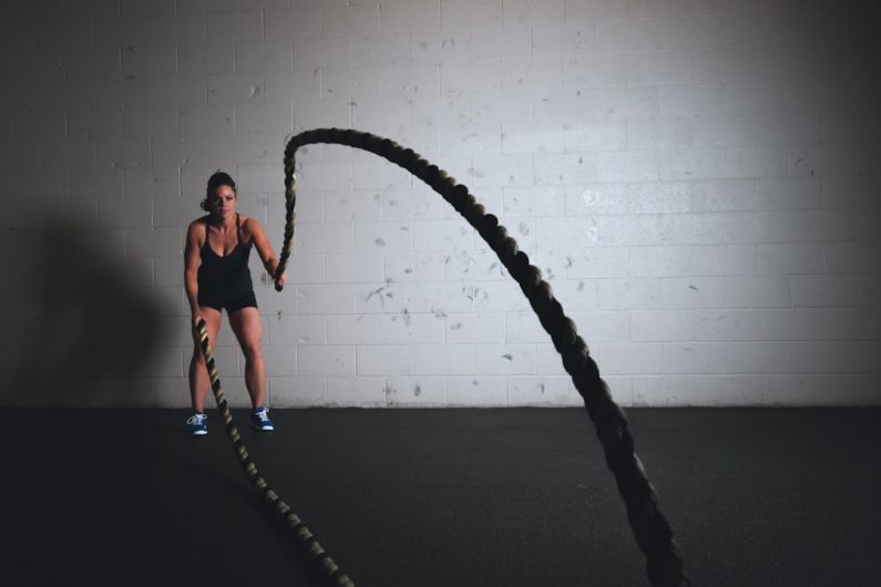 Beginner Workout - woman holding brown ropes