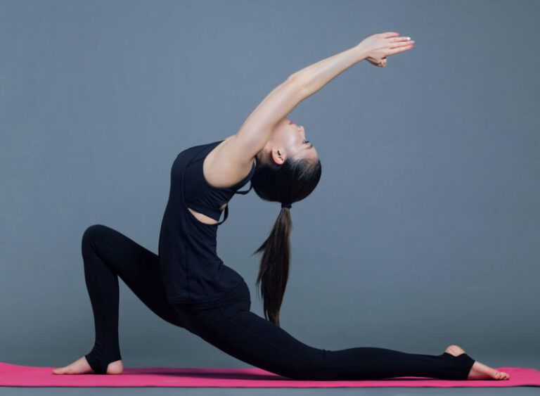 Yoga Pose - woman in black tank top and black pants doing yoga