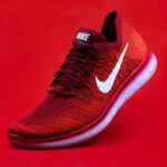 Running Shoes - unpaired red Nike sneaker