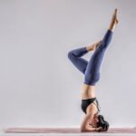 Yoga Pose - woman in blue denim jeans and black leather shoes