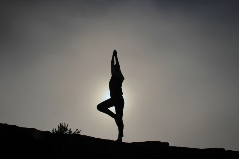 Vinyasa Yoga - person doing yoga exercises