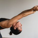 Hot Yoga - woman stretching arms